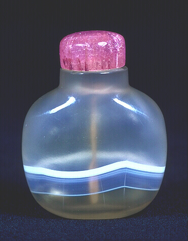 A white banded, very well hollowed, chalcedony snuff bottle with a pink tourmaline stopper. 