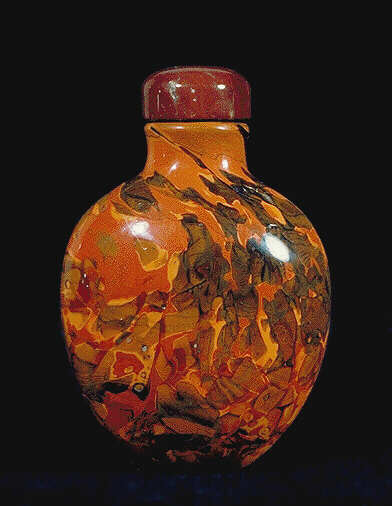 Glass Snuff Bottle, of mottled and striated opaque ochre, green, brown and red colours, interspersed with colourless transparent areas.