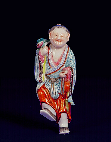 A Jingdezhen moulded porcelain snuff bottle, painted in enamels and moulded in the form of Liu Hai, standing with one foot raised, clutching a string of cash and carrying a scaly three-legged toad on his shoulder.