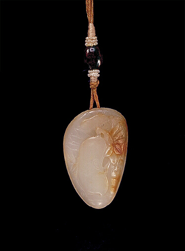 Reverse: Nephrite pendant, pale grey with light brown russet areas carved as cicada gripping a pea pod with leaves.
