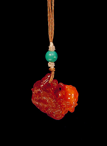 Reverse: Amber pendant of the variety known as Baltic, bright yellow with darker translucent colour, carved in the form of a Fo dog with its young.