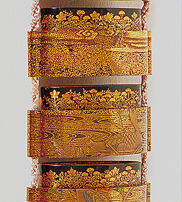 Close-Up Reverse: Ducks Inro with a metal inlaid ojime