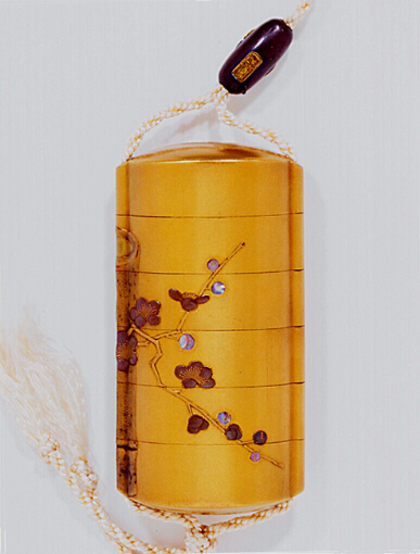 Close-Up Reverse: Bamboo and Prunus Inro with metal and gold ojime