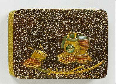 Japanese lacquer: A Kobako decorated with a suit of armour and sword all in gold and coloured takamakie.